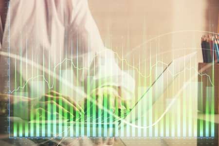 Double exposure of woman hands typing on computer and forex chart hologram drawing. Stock market invest concept.の写真素材