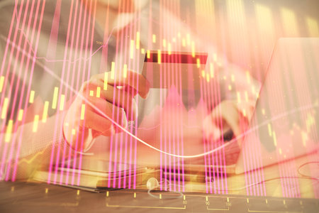 Double exposure of man hands holding a credit card and Forex graph drawing. Stock trading and digital fintech in Internet E-commerce concept.の写真素材