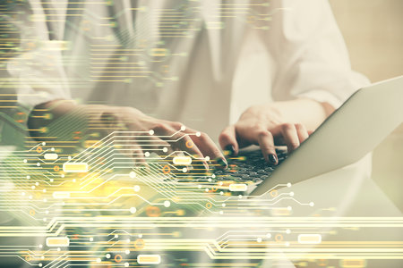 Double exposure of woman hands working on computer and data theme hologram drawing. Tech concept.の写真素材
