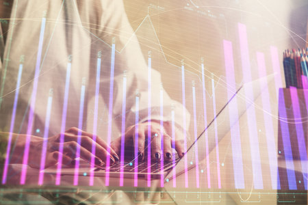 Double exposure of woman hands typing on computer and forex chart hologram drawing. Stock market invest concept.の写真素材
