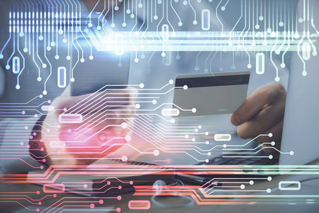Double exposure of man hands holding a credit card and data theme drawing. E-commerce and technology concept.の写真素材