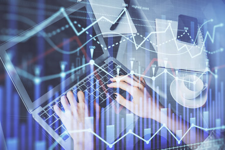 Double exposure of woman hands typing on computer and forex chart hologram drawing. Stock market invest concept.の写真素材