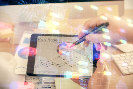 Multi exposure of man's hands holding and using a digital device and data theme drawing. Innovation concept.の写真素材
