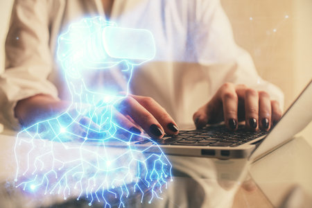Double exposure of woman hands typing on computer and man in AR glasses drawing. Education concept.の写真素材