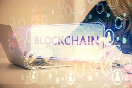 Multi exposure of woman on-line shopping holding a credit card and crypto theme drawing. Blockchain E-commerce concept.の写真素材