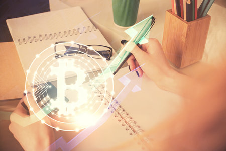 Multi exposure of woman on-line shopping holding a credit card and crypto theme drawing. Blockchain E-commerce concept.の写真素材