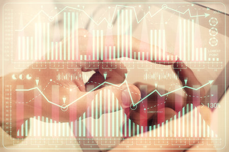 Multi exposure of man's hands holding and using a phone and financial chart drawing. Market analysis concept.の写真素材