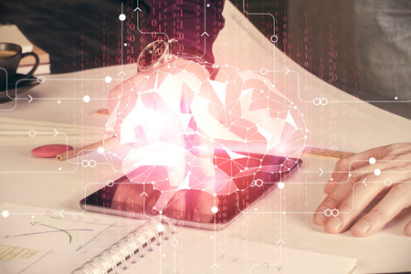 Double exposure of man's hand holding and using a digital device and brain hologram drawing. Data concept.の写真素材