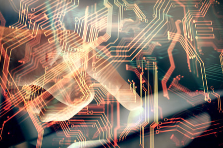 Double exposure of man's hands holding and using a digital device and tech theme hologram drawing. Technology concept.の写真素材
