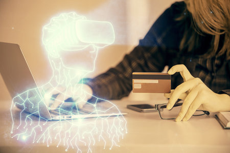 Multi exposure of woman on-line shopping holding a credit card and man in AR glasses drawing. E-learning concept.の写真素材