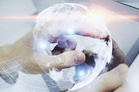 Double exposure of man's hands holding and using a phone and international business theme drawing.の写真素材