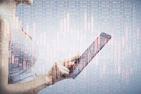 Double exposure of forex chart sketch hologram and woman holding and using a mobile device. Financial market concept.の写真素材