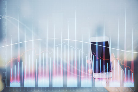 Double exposure of forex chart sketch hologram and woman holding and using a mobile device. Stock market concept.の写真素材