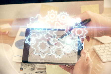 Double exposure of man's hands holding and using a phone and international business theme drawing.の写真素材