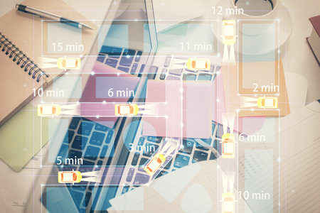 Auto pilot hologram drawing over computer on the desktop background. Top view. Double exposure. Tech concept.の写真素材