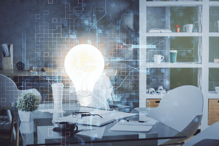 Double exposure of bulb and office interior background. Concept of idea.の写真素材