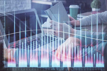Double exposure of man and woman working together and forex chart hologram. Business concept. Computer background.の写真素材