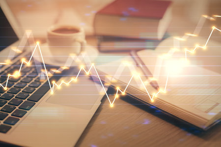 Double exposure of forex chart drawing and desktop with coffee and items on table background. Concept of financial market tradingの写真素材