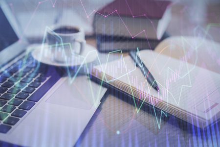 Double exposure of forex chart drawing and desktop with coffee and items on table background. Concept of financial market tradingの写真素材