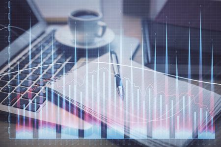 Double exposure of forex chart drawing and desktop with coffee and items on table background. Concept of financial market tradingの写真素材