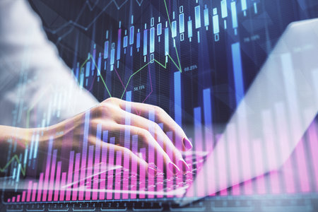 Double exposure of businesswoman hands typing on computer and forex chart hologram drawing. Financial analysis concept.の写真素材