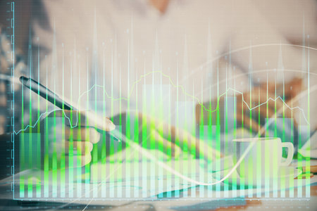 Double exposure of forex graph drawing over people taking notes background. Concept of financial analysisの写真素材