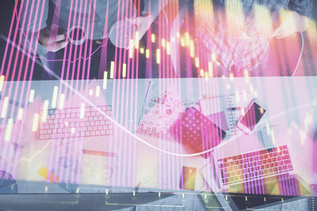 Double exposure of man and woman working together and financial chart hologram drawing. market analysis concept. Computer background. Top View.の写真素材