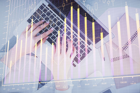 Double exposure of woman hands working on computer and forex graph hologram drawing. Top View. Financial analysis concept.の写真素材
