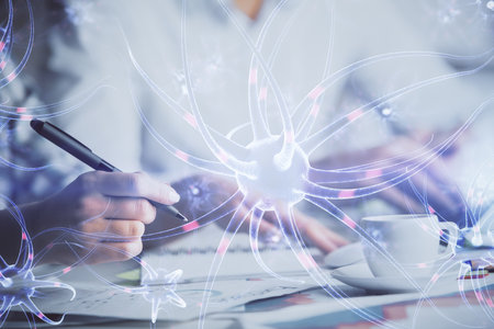 Double exposure of neuron theme drawing over people taking notes background. Concept of medical educationの写真素材