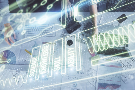 Double exposure of man and woman working together and education theme hologram drawing. Computer background.の写真素材
