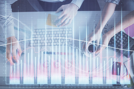Double exposure of man and woman working together and financial chart hologram drawing. market analysis concept. Computer background. Top View.の写真素材