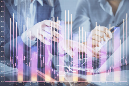 Multi exposure of man and woman working together and financial chart hologram. Business concept. Computer background.の写真素材