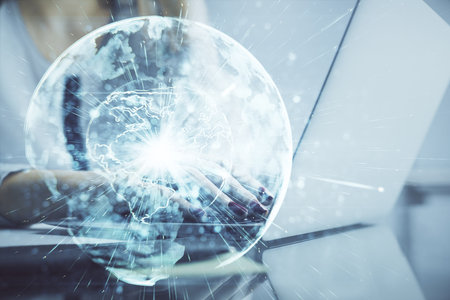 Multi exposure of woman hands typing on computer and business theme hologram drawing. Success concept.の写真素材