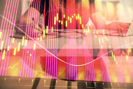 Double exposure of businesswoman hands typing on computer and forex chart hologram drawing. Financial analysis concept.の写真素材