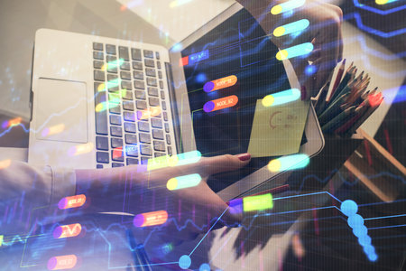 Multi exposure of woman hands working on computer and data theme hologram drawing. Tech concept.の写真素材