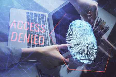 Double exposure of woman hands typing on computer and fingerprint drawing. Security concept.の写真素材