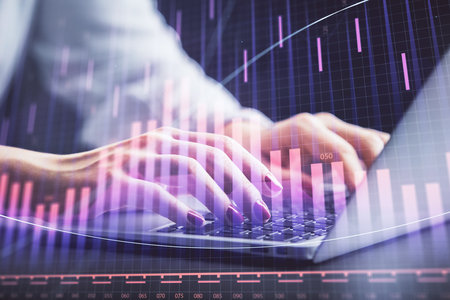 Double exposure of businesswoman hands typing on computer and forex chart hologram drawing. Financial analysis concept.の写真素材