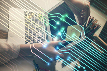 Multi exposure of woman hands working on computer and data theme hologram drawing. Tech concept.の写真素材