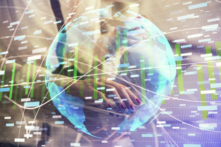Multi exposure of woman hands typing on computer and business theme hologram drawing. Success concept.の写真素材
