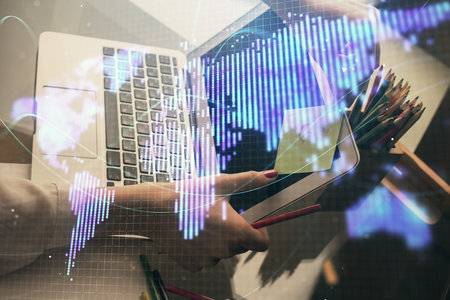 Multi exposure of woman hands typing on computer and business theme hologram drawing. Success concept.の写真素材