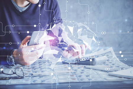 Double exposure of man's hand holding and using a digital device and brain hologram drawing. Data concept.の写真素材