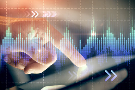 Multi exposure of man's hands holding and using a phone and financial chart drawing. Market analysis concept.の写真素材