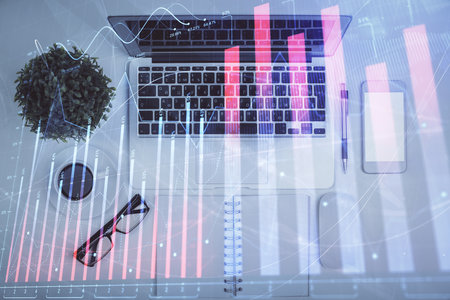 Multi exposure of forex chart drawing over table background with computer. Concept of financial research and analysis. Top view.の写真素材
