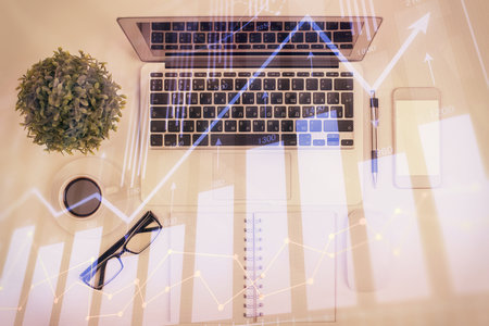 Multi exposure of forex chart drawing over table background with computer. Concept of financial research and analysis. Top view.の写真素材