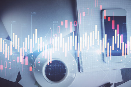 Multi exposure of forex graph hologram over desktop with phone. Top view. Mobile trade platform concept.の写真素材