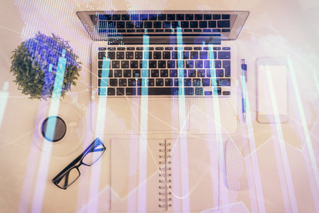 Multi exposure of forex chart drawing over table background with computer. Concept of financial research and analysis. Top view.の写真素材