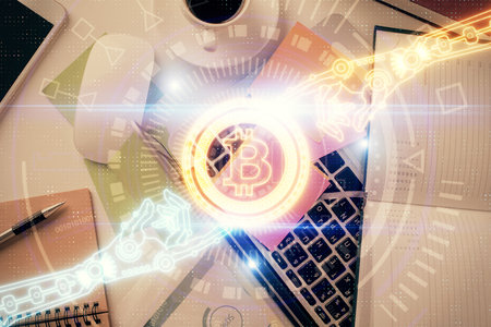 Blockchain theme hologram drawings over computer on the desktop background. Top view. Multi exposure. Concept of cryptoeconomy.の写真素材