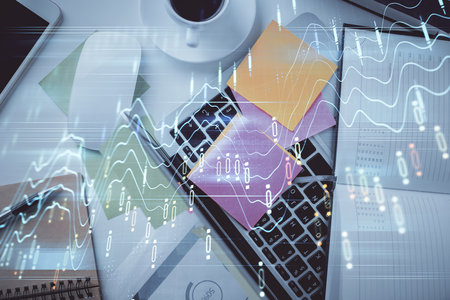 Multi exposure of financial chart drawing over table background with computer. Concept of research and analysis. Top view.の写真素材