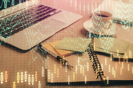 Multi exposure of forex graph drawing and desktop with coffee and items on table background. Concept of financial market tradingの写真素材
