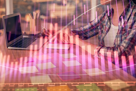 Double exposure of businesswoman hands typing on computer and forex graph hologram drawing. Financial analysis concept.の写真素材